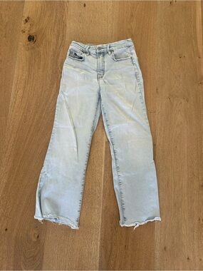 Good American light distressed jeans, flattering fit